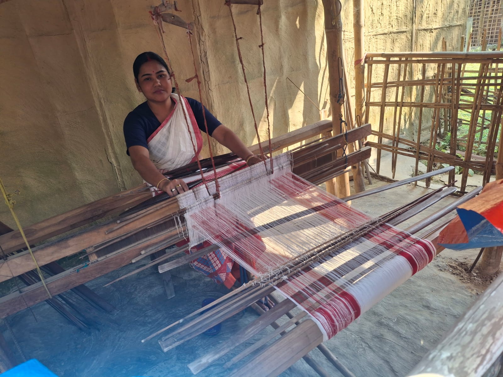 Women working on handloom training